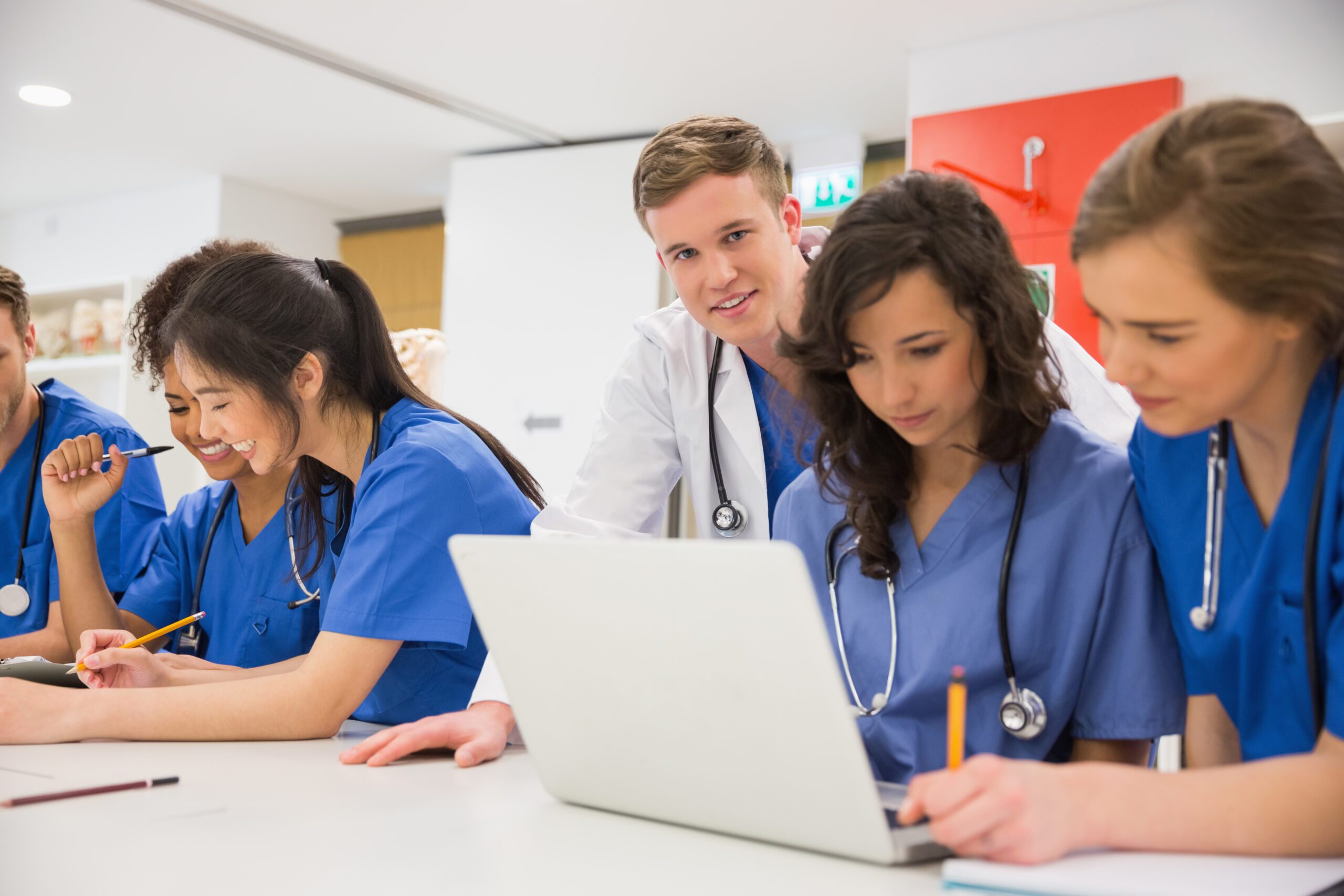 Medical student smiling at the camera during class at the university